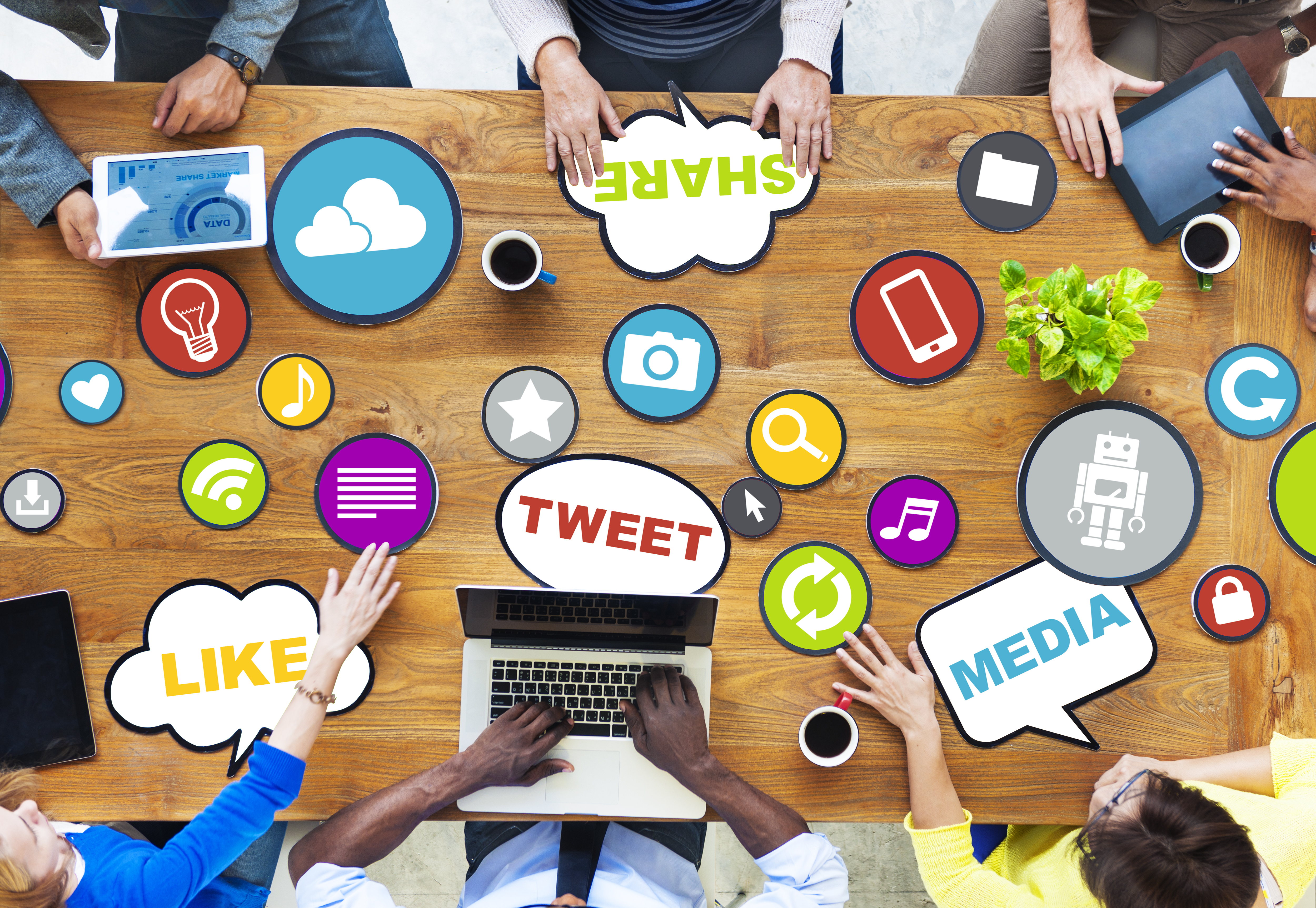 overlook of a table with various stickers relative to social media
